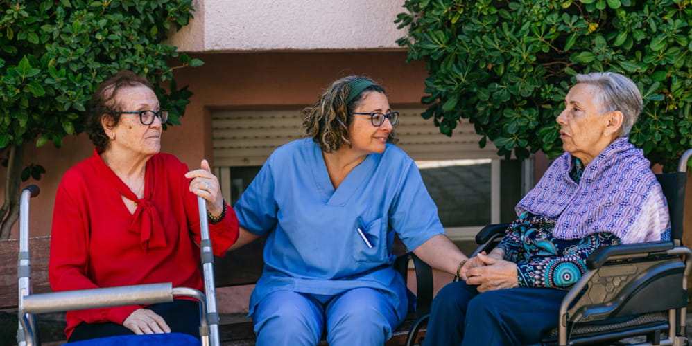 Illustration of a home nursing visit in a sunroom. Not a Villa participant or employee.