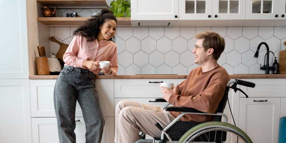 Illustration of two young adults leaving a suburban house, one using crutches. Not a Villa participant or employee.